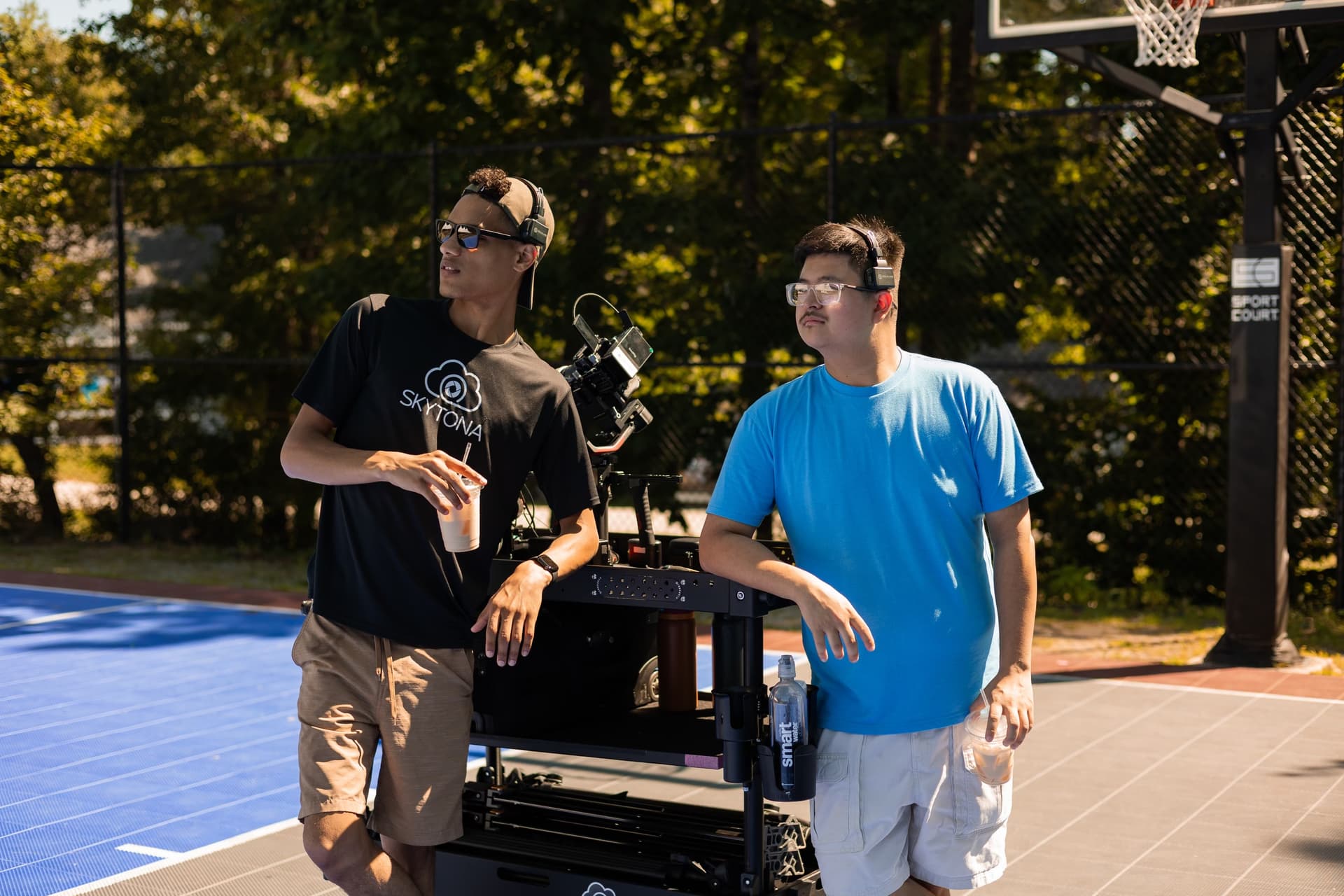 Two Skytona team members with the production cart between setups