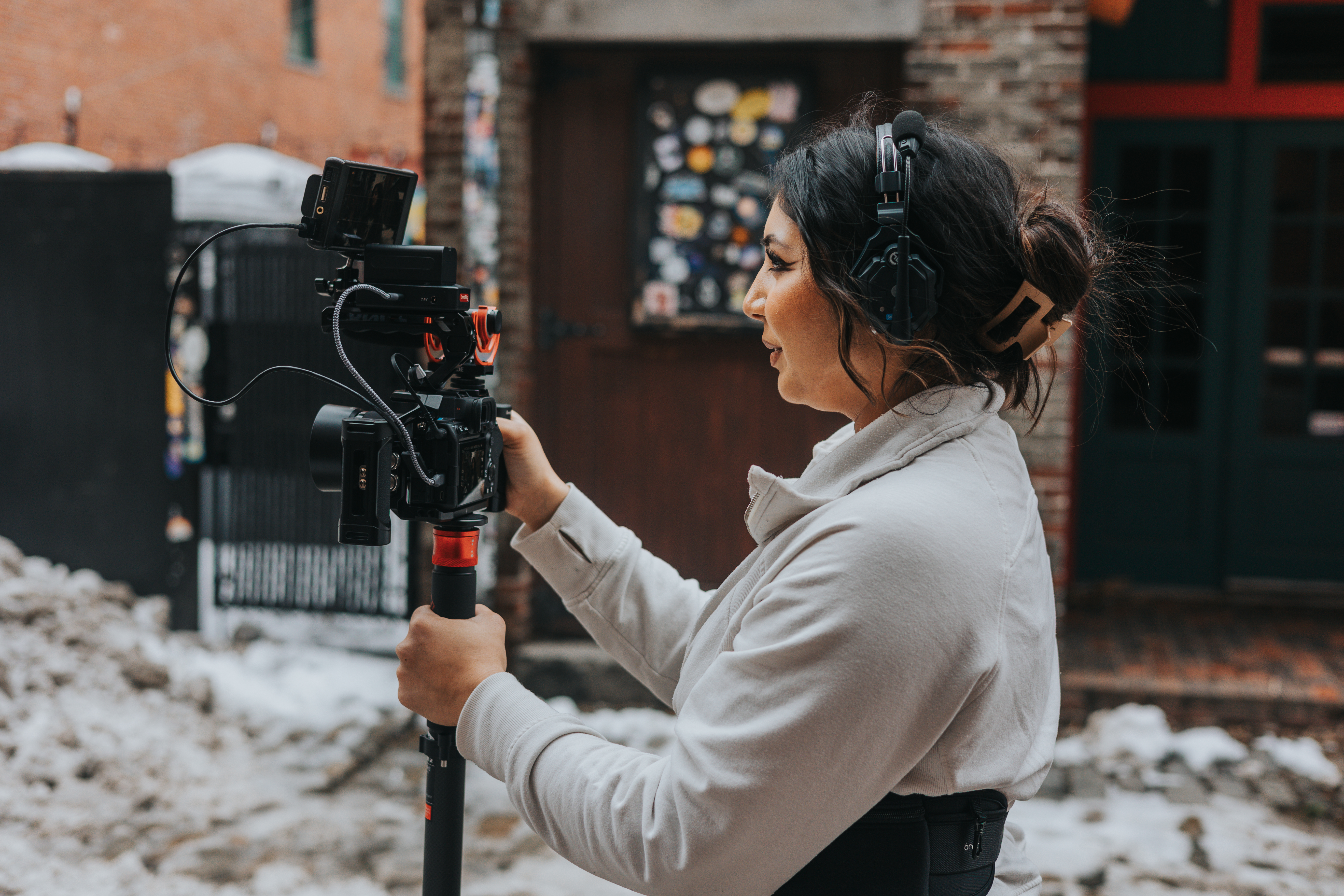 Asha filming at a wedding