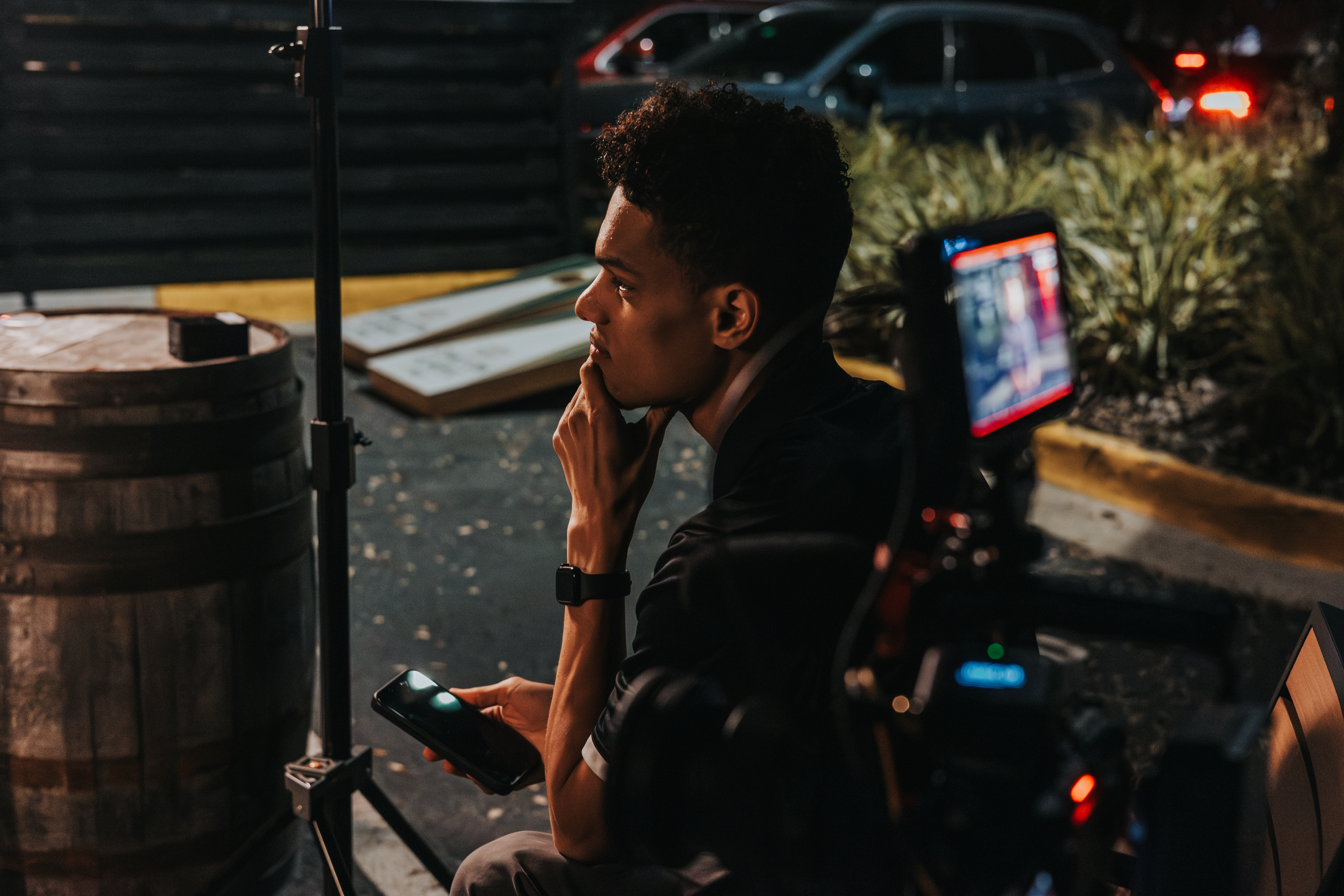 Jad reviewing footage on set, thinking through the narrative approach