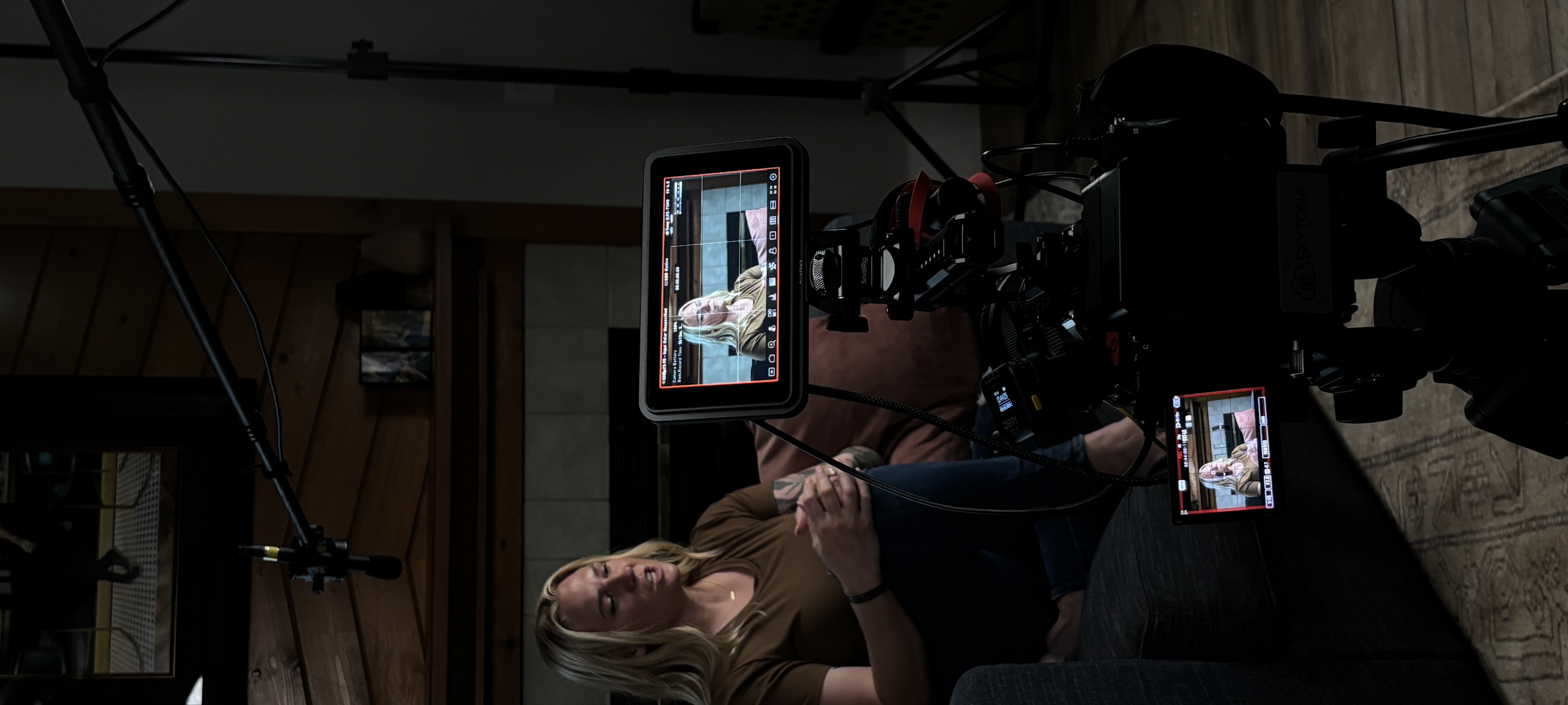 Two monitors on a Skytona cinema rig during a documentary interview